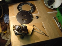  prise pointer and face off, start removing small screws and tiny springs